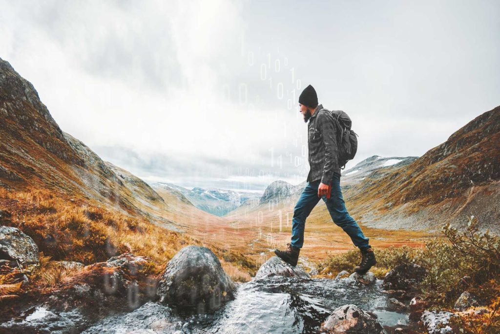 man walking in a mountainview